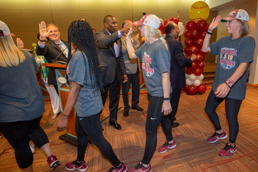 FSU National Champion softball players exchange high-fives with Tallahassee city commissioners on June 6, 2018. (FSU Photography Services)