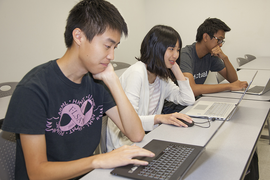 Doctoral student Olumide Abioye teaches Andrew Yuan, Rachel Lee and Andrew Ma about simulation modeling as part of the Florida State University Young Scholars Program.