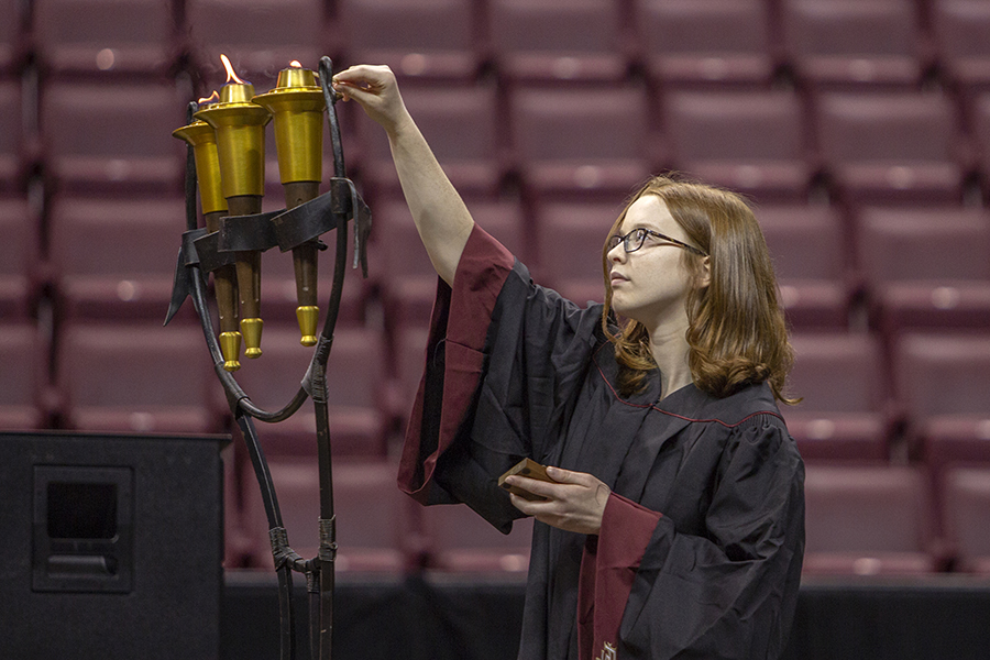 A student lights a torch during FSU New Student Convocation Sunday, Aug. 26, 2018. (FSU Photography Services)