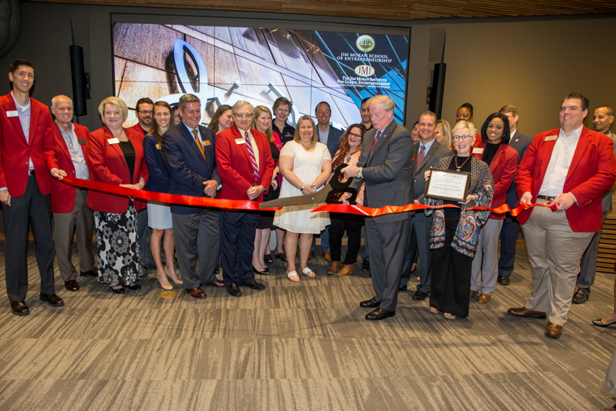 FSU President John Thrasher cuts a ribbon to celebrate the opening of the facility. It's home to the Jim Moran School of Entrepreneurship and the Jim Moran Institute for Global Entrepreneurship. (May 1, 2018 — FSU Photography Services)