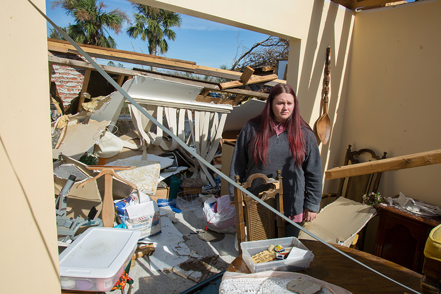 King attempts to sort through her belongings in the midst of devastation. (Bill Lax/FSU Photography Services)