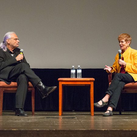 Paul Cohen, executive director of the Torchlight Program, discusses "Memphis Belle" with Catherine Wyler, daughter of filmmaker William Wyler at the 8th annual Veterans Film Showcase. (FSU Photography Services)