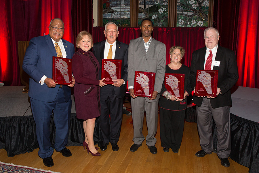 2018 Torch Award winners (from left): Melvin Stith; Nan and Mark Hillis; Charlie Ward; Val Richard Auzenne, accepting for Barry Jenkins; and Don Gibson. (FSU Photography Services)