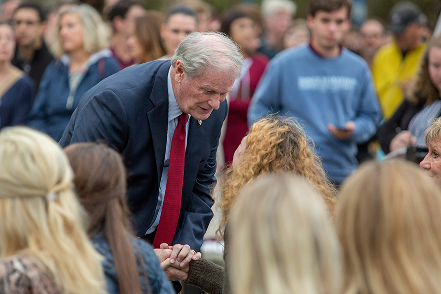 President John Thrasher talks with family of victims at Sunday's candlelight vigil. (FSU Photography Services)