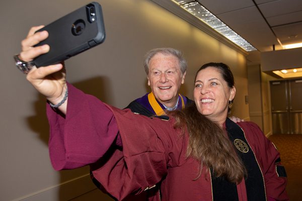 President John Thrasher and head softball coach Lonni Alameda at Florida State University fall commencement Dec. 15, 2018. (FSU Photography Services)