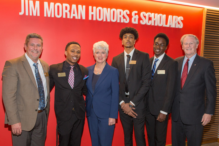 Randy Blass, Jan Moran and President John Thrasher recognized Jim Moran Scholars Hakeem Hunter, Robel Mechal and Jerry Jean-Pierre at a special reception at the Jim Moran Building in downtown Tallahassee, Jan. 16, 2019. (FSU Photography Services)