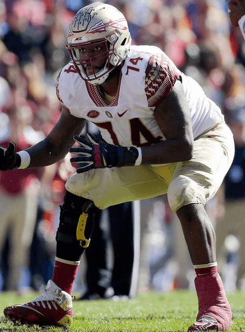 Though the brace has to be concealed with tape during games, players like former FSU offensive lineman Derrick Kelly (above) still benefit from its reinforced support.