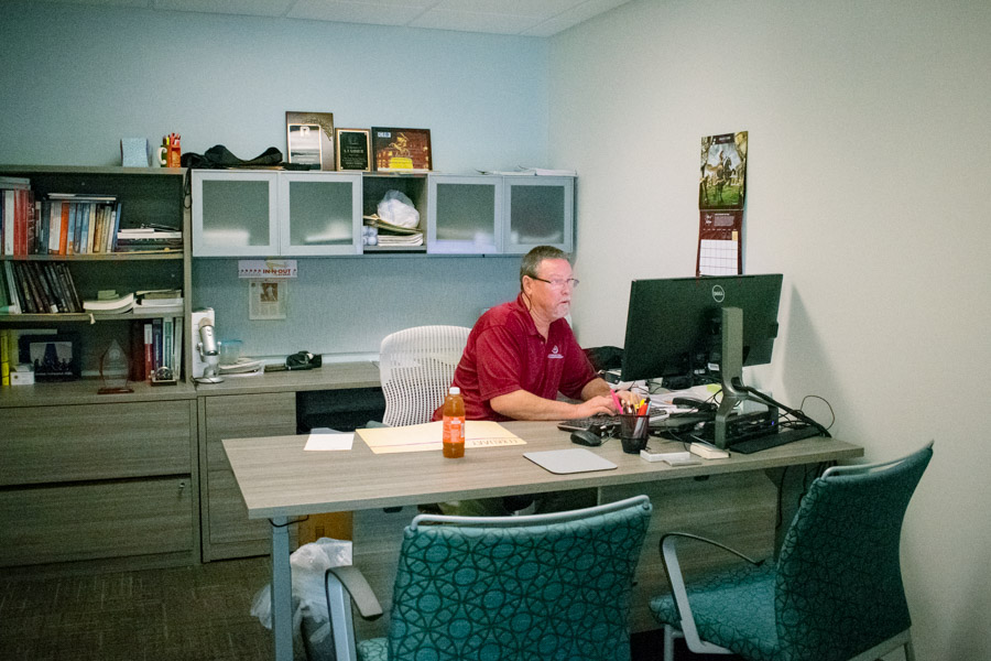 Entrepreneur-in-Residence Bob Garner prepares for classes in his new office in the Shaw Building.