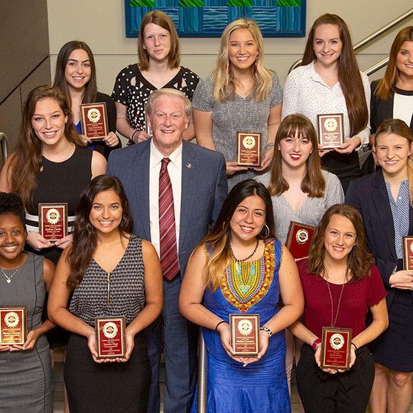 President Thrasher with the 2019 Humanitarian of the Year nominees. (From left to right) First row: Essence Duncan, Jennifer Magi, Melissa Carcamo, Emily Botta. Second row: Kathryn Casello, President John Thrasher, Sarah Grice, Rachel Castelli. Third row: Cara Steinberg, Madelene Wishart, Savannah Calleson, Angela Byrne, Monica McShaffrey. (FSU Photography Services)