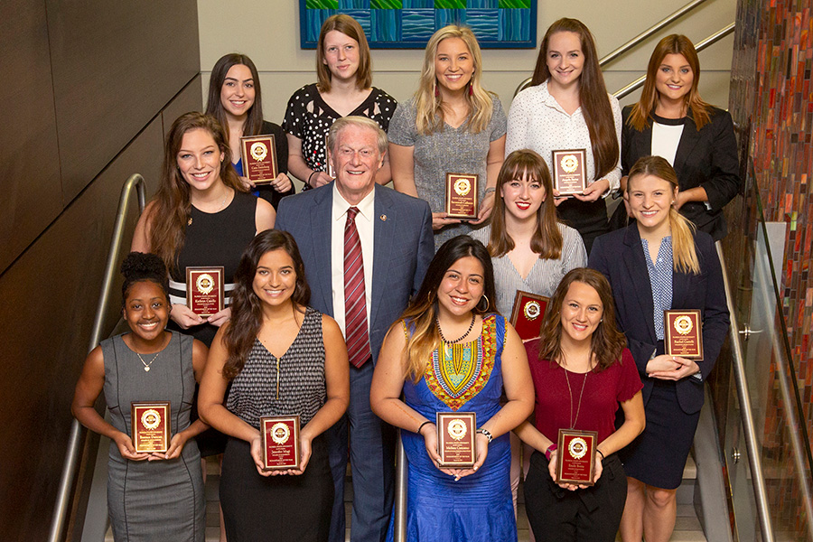 President Thrasher with the 2019 Humanitarian of the Year nominees. (From left to right) First row: Essence Duncan, Jennifer Magi, Melissa Carcamo, Emily Botta. Second row: Kathryn Casello, President John Thrasher, Sarah Grice, Rachel Castelli. Third row: Cara Steinberg, Madelene Wishart, Savannah Calleson, Angela Byrne, Monica McShaffrey. (FSU Photography Services)