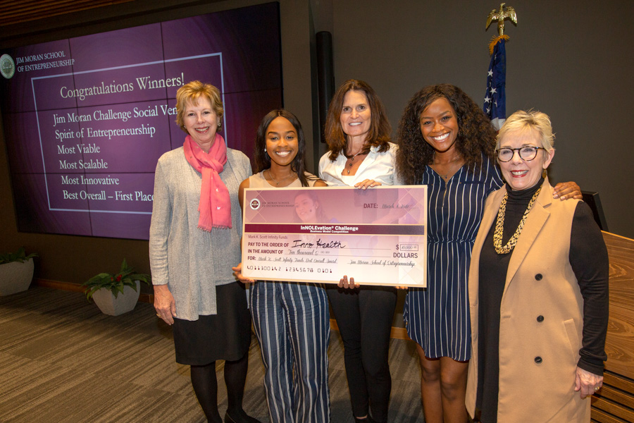 InnoHealth Diagnostics won the Mark K. Scott Infinity Funds $10,000 First Place prize at the InNOLEvation® Challenge. From left to right: Wendy Plant, Angela Udongwo of InnoHealth, Elizabeth Scott (judge), Nkechi Emetuche of InnoHealth and Susan Fiorito. (FSU Photography Services)