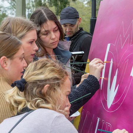 Friends and classmates of Maura Binkley paint a mural in support of Maura's Voice. (Bill Lax/FSU Photography Services)