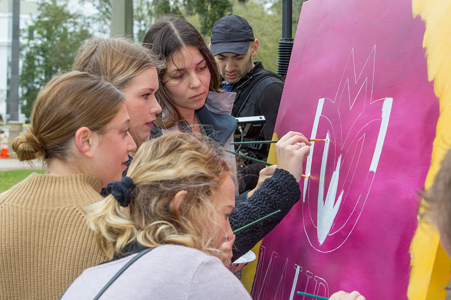Friends and classmates of Maura Binkley paint a mural in support of Maura's Voice. (Bill Lax/FSU Photography Services)