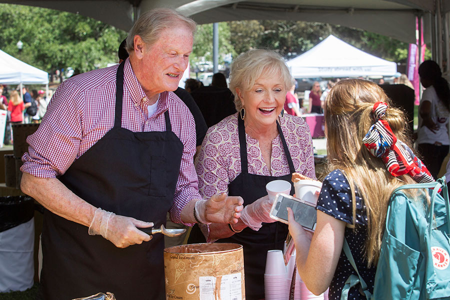 FSU President John Thrasher and First Lady Jean Thrasher serve chocolate ice cream at The President’s Ice Cream Social on Landis Green, April 10, 2019. (FSU Photography Services)