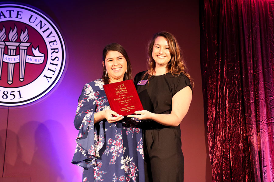 Daniela Villasmil accepts an Outstanding Student Leader Award from Student Program Coordinator Julie Fleishman at the Leadership Awards Night April 9, 2019. (Photo: Division of Student Affairs)