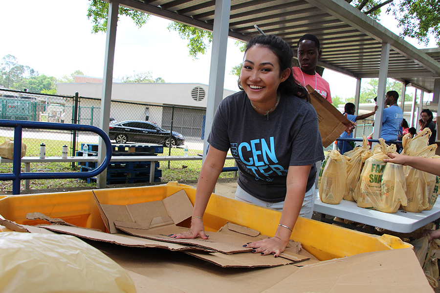 Florida State University students and PeaceJam Conference attendees from across the Southeast work with FarmShare to prepare a truckload of food for distribution at Sabal Palm Elementary School Saturday, April 6, 2019.