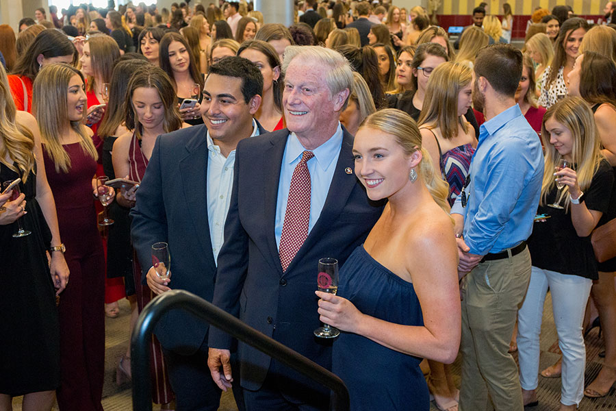 FSU President John Thrasher poses for a picture with graduating students at the 2019 President's Senior Toast. (FSU Photography Services)