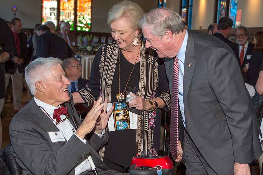 President John Thrasher and First Lady Jean Thrasher celebrate with President Emeritus Sandy D'Alemberte during the unveiling of D'Alemberte's stained glass window in the Heritage Museum in 2017. (FSU Photography Services)
