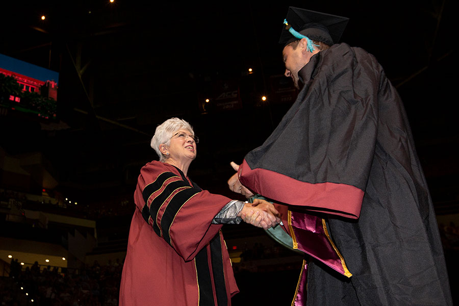 Jan Moran congratulates Cory Witt, the first graduate of the Jim Moran School of Entrepreneurship, during FSU spring commencement Friday, May 3, 2019.