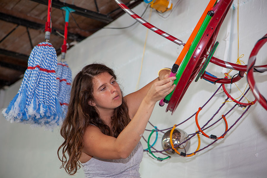 Sophia Baldwin puts the finishing touches on her group's project for the Mechatronic Art class at FSU. (Patricia)