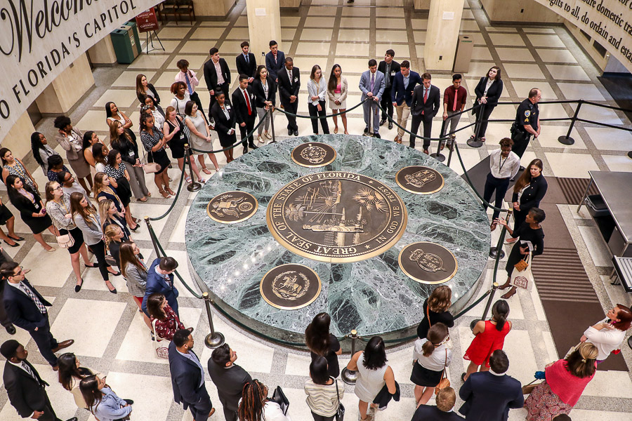 Students pause in the Capitol Rotunda at the entrance of the state Capitol.