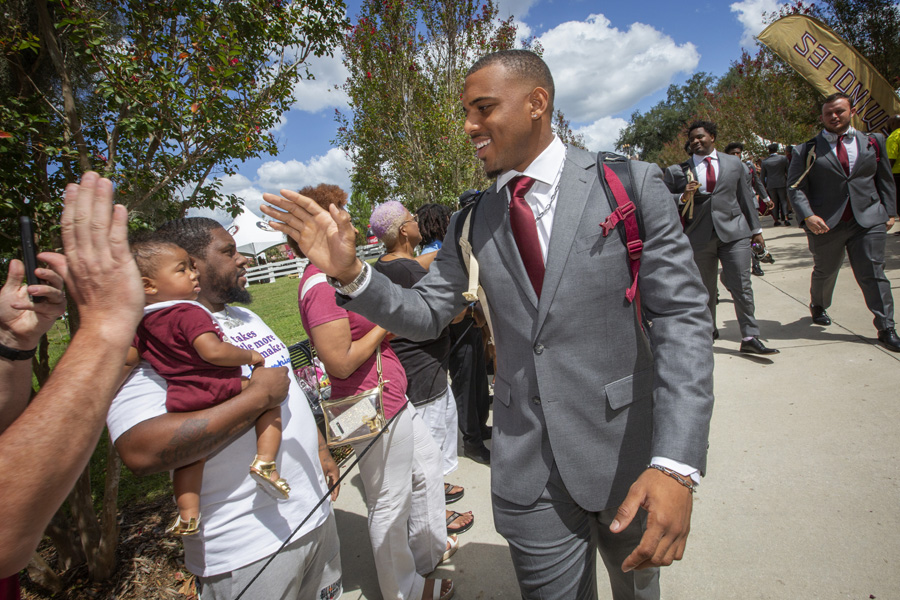 FSU Football players arrive at the Legacy Team Walk before the Louisville game Sept. 21, 2019. (FSU Photography Services)