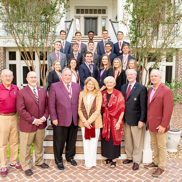 James and Martha Seneff with inaugural cohort of the FSU College of Business’ James M. Seneff Scholars on Saturday, Sept. 28, at a celebratory event hosted by President John Thrasher and First Lady Jean Thrasher at the FSU President’s House in Tallahassee. (Pictured from left) Back row: Cole Bakotic, Andrew Colvin, Kenneth Frazier, Michael Ramsey, Dexter Bell; Second row: Cameron Strickler, Matthew Williams, Christian Glover, Carlos Rodriguez, Alexander Suriano; Third row: Ivy Van Dyke, Judith Wieland, Matthew Hader, Katherine Newcomb, Mary Katherine Marasco and Sophia Metallo; Front row: FSU Board of Trustees member Mark Hillis, College of Business Dean Michael Hartline, James M. Seneff, Martha Seneff, FSU First Lady Jean Thrasher, FSU President John Thrasher and FSU Board of Trustees Chairman Ed Burr.