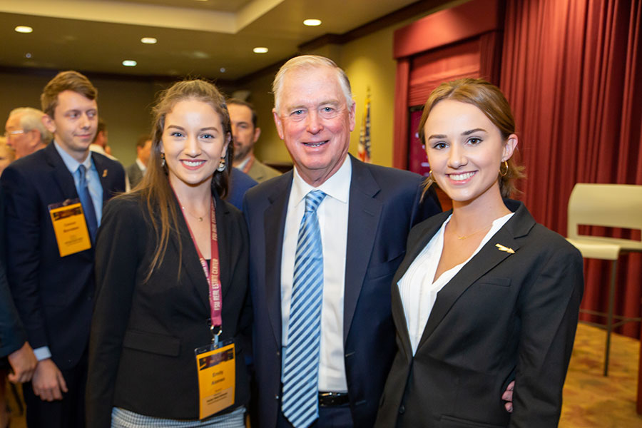 Dan Quayle, former vice president of the United States, poses with students at the FSU Real Estate Center's 25th Real Estate TR