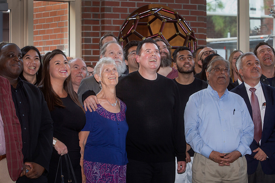 Margaret and Stephen Kroto (center) join a crowd at the Chemical Sciences Laboratory to dedicate the auditorium in Sir Harold Kroto's honor.