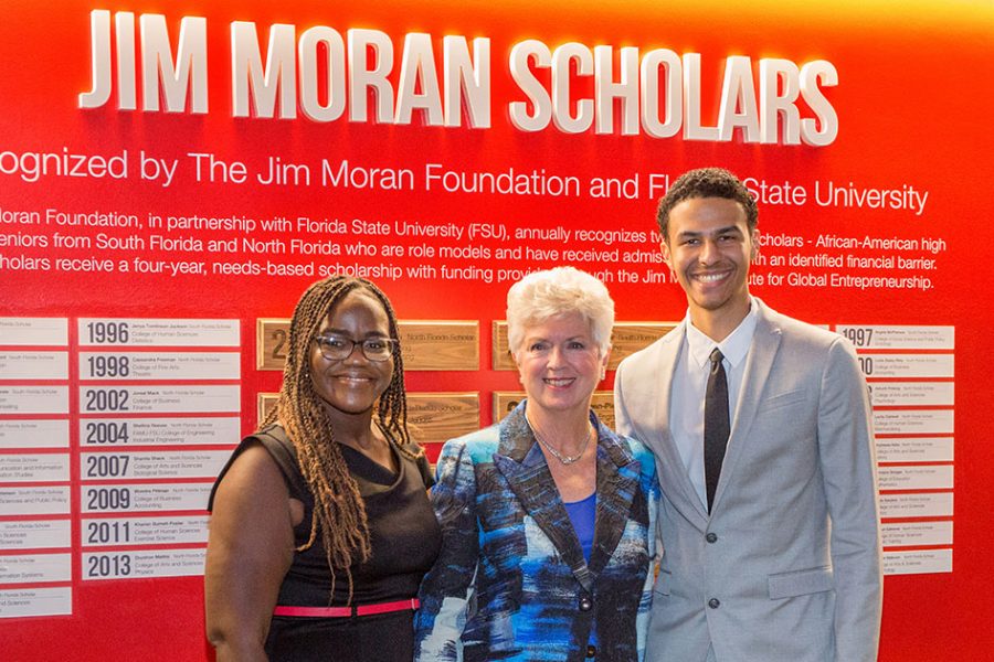 2019 Jim Moran Scholars Kiara Guerrier and Alejandro Robins with Jan Moran during a reception Wednesday, Oct. 16, 2019, at the Jim Moran Building in Tallahassee. (FSU Photography Services)