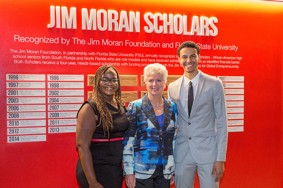 2019 Jim Moran Scholars Kiara Guerrier and Alejandro Robins with Jan Moran during a reception Wednesday, Oct. 16, 2019, at the Jim Moran Building in Tallahassee. (FSU Photography Services)