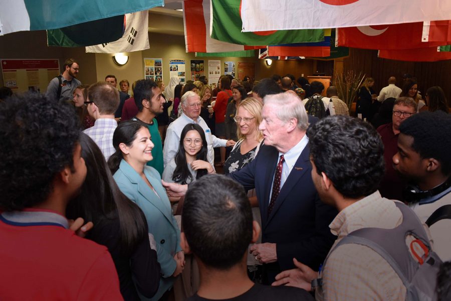 President Thrasher meets with students during the opening reception of International Education Month.