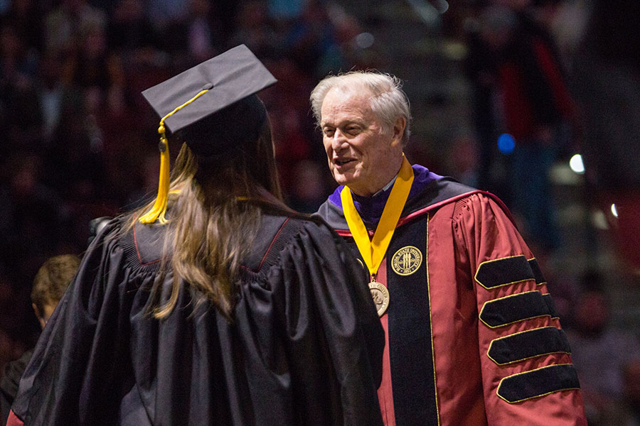 President John Thrasher congratulates graduates during FSU’s 2019 fall commencement. (FSU Photography Services/Bill Lax)