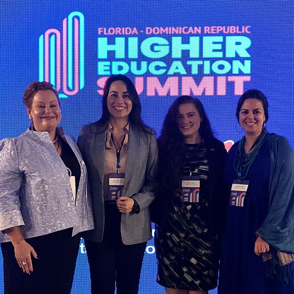 (From left) Professor Audrey Casserleigh, Florida A&M faculty member Paula Gomez, FSU doctoral student Becca Rogers, Associate Professor Lara Perez-Felkner (far right) with colleagues at the Florida-Dominican Republic Higher Education Summit.