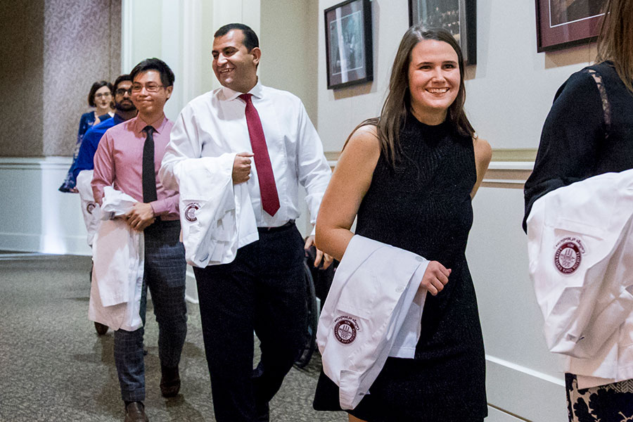 Tamer Tadros (middle) is one of 37 members of FSU's School of Physician Assistant Practice first graduating class.