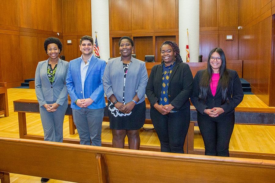 Pictured (from left): Daynica Harley, Austin Richard Diaz, Clinical Professor Carla Laroche, Julisa Renaud and Gabriella Hernandez of the Gender and Family Justics Clinic. (FSU Photography Services)