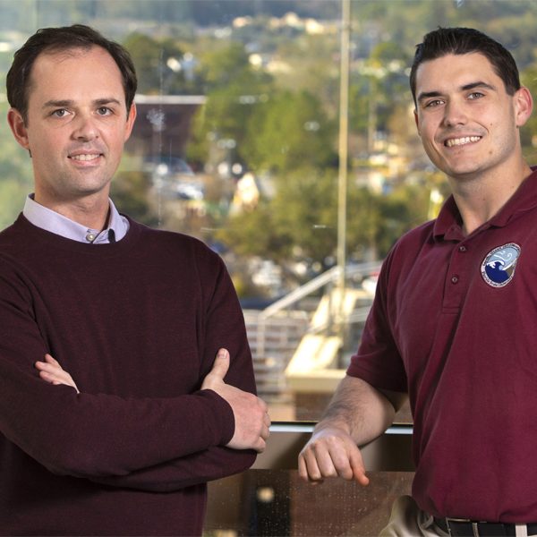 From left, Christopher Holmes, the Werner A. and Shirley B. Baum assistant professor of meteorology in the Department of Earth, Ocean, and Atmospheric Science at Florida State University, and Jason Ducker, a postdoctoral researcher. Their research compared levels of atmospheric ozone to the amount of ozone plants took in through pores on their leaves at more than 30 sites over 10 years. They found that environmental factors have more impact on the ozone dose the plants received than the amount of ozone in the atmosphere. (Bruce Palmer / FSU Photography Services)