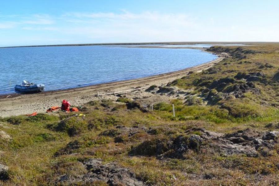 A view of one of the research team’s study sites near Kaktovik, Alaska. Shallow groundwater flows beneath the tundra surface into the adjacent lagoon. Photo by: M. Bayani Cardenas / University of Texas at Austin