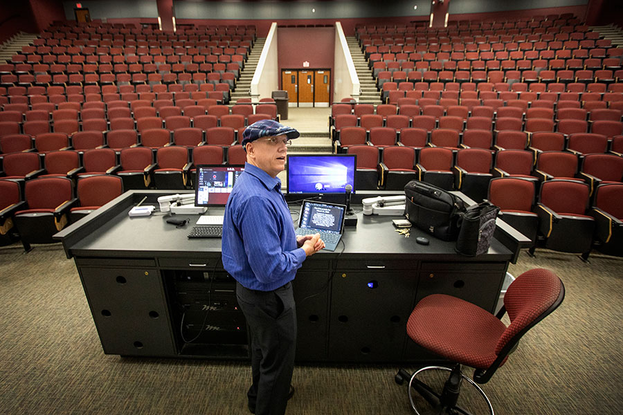 Michael Hammock, an assistant teaching professor of economics, taught his class via YouTube in the vacant lecture hall that holds 500 students. (FSU Photography Services/Bruce Palmer)