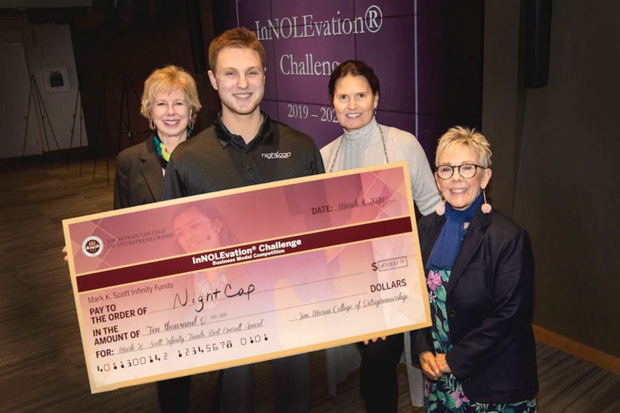 From left, Wendy Plant, Jim Moran College; Michael Bernarde, InNOLEvation competition winner; Elizabeth Scott, who donated the grand prize along with her husband Mark; and dean of the Jim Moran College of Entrepreneurship, Susan Fiorito.