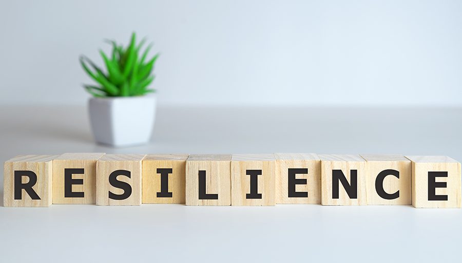 Resilience word concept on cubes on white background.