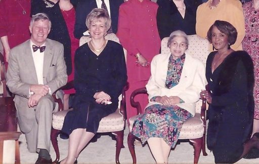 Groomes-McLendon kneeling next to Rosa Parks with President Sandy D’Alemberte and First Lady Patsy Palmer at the reception welcoming Parks for her honorary degree ceremony in 1994.