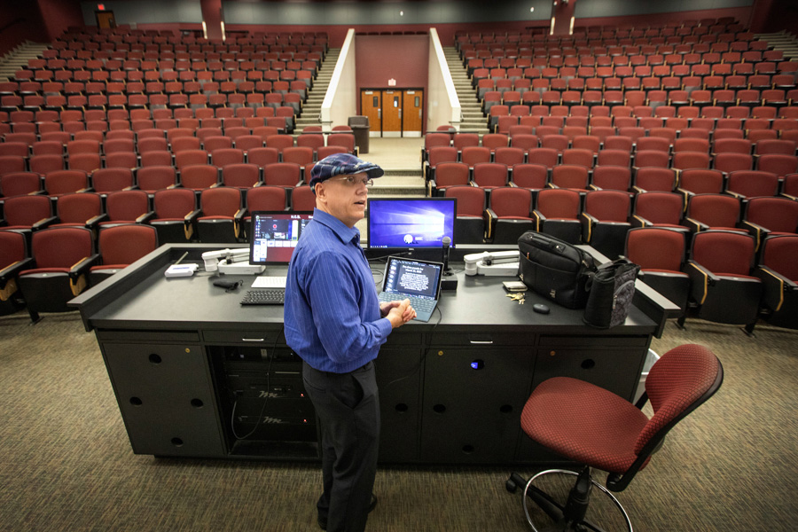 Michael Hammock, an assistant teaching professor of economics, teaches his class via YouTube in the vacant lecture hall that holds 500 students March 23, 2020. (FSU Photography Services/Bruce Palmer)