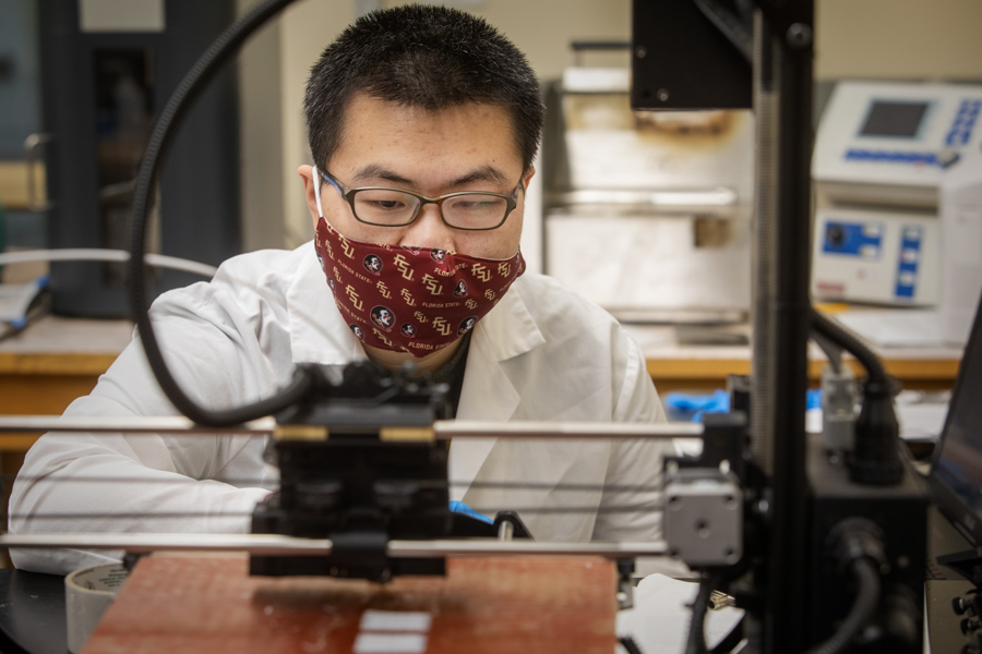 Graduate student, Xiaolin Wang, in the manufacturing bay of the Materials Research Building at HPMI 2020 (FSU Photography Services)
