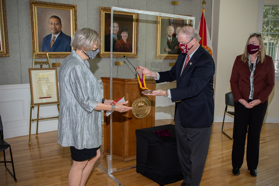 President John Thrasher posthumously awards the Westcott Medal to Talbot'Sandy' D'Alemberte in a ceremony at the College of Law Sept. 22, 2020. D'Alemberte's wife Patsy Palmer accepts the award from Thrasher. (FSU Photography Services)
