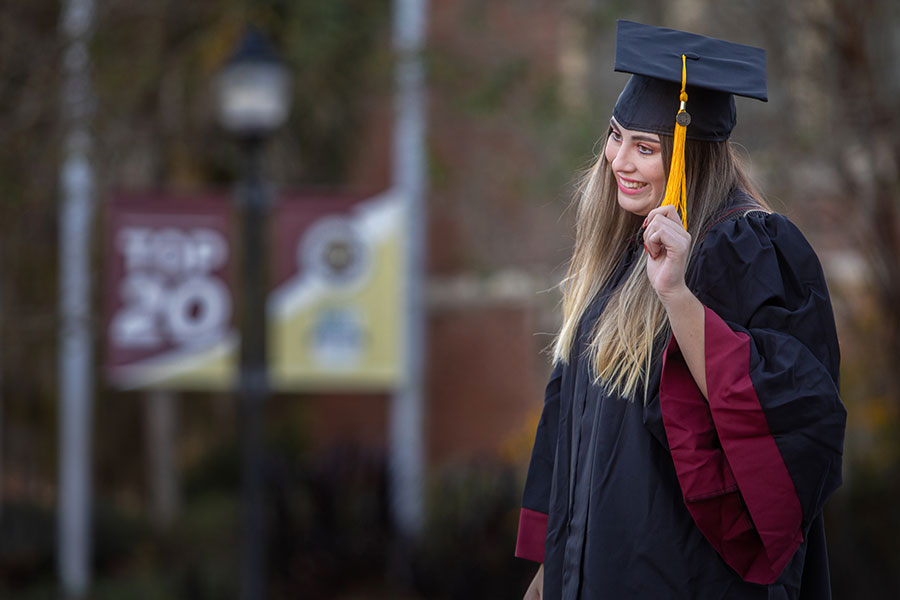 New Florida State University graduates celebrate with the tradition of photo shoots in Westcott Plaza leading up to fall virtual commencement Dec. 12, 2020. (FSU Photography Services)