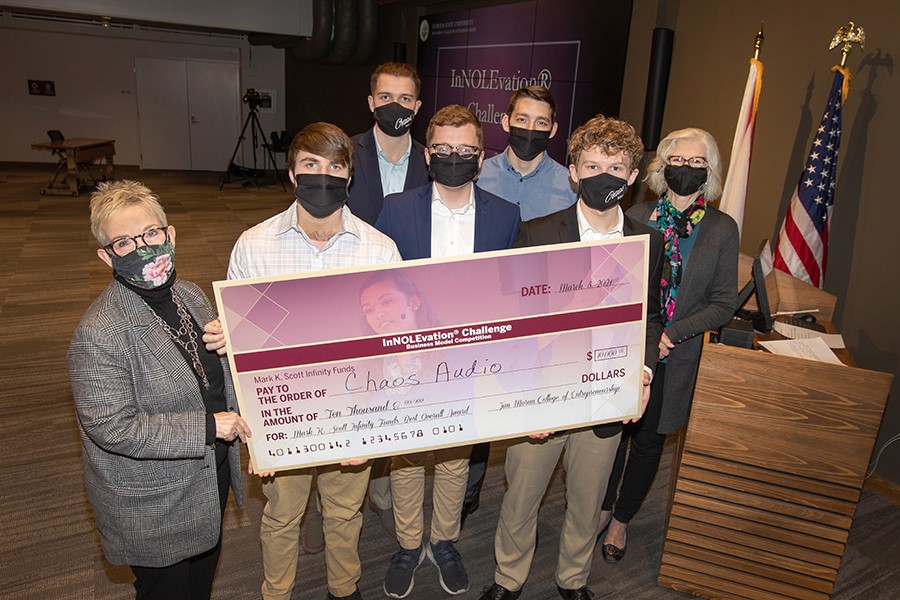 Front row from the left: Susan Fiorito, Dean of the Jim Moran College, with Cameron Jones, Samuel Lamb and Landon McCoy, of Audio Chaos and Wendy Plant, director of the InNOLEvation competition. Back row: Armis Sunday, Robert Copsey of Audio Chaos.