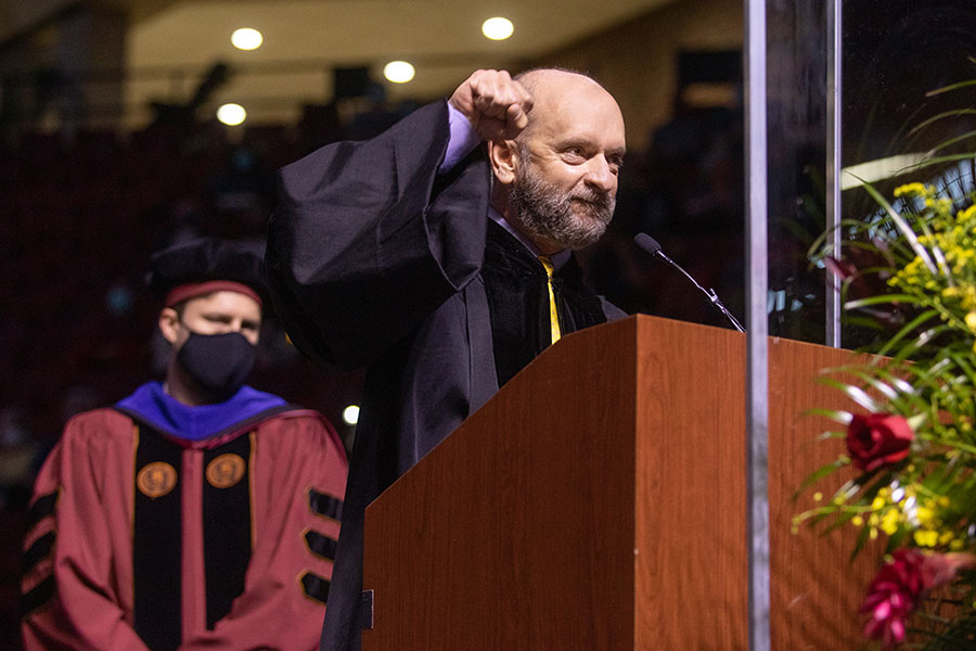 Mark Zeigler, teaching faculty in the School of Communication, reads graduates' names during spring commencement Saturday, April 17, 2021, at the Donald L. Tucker Civic Center. (FSU Photography Services)
