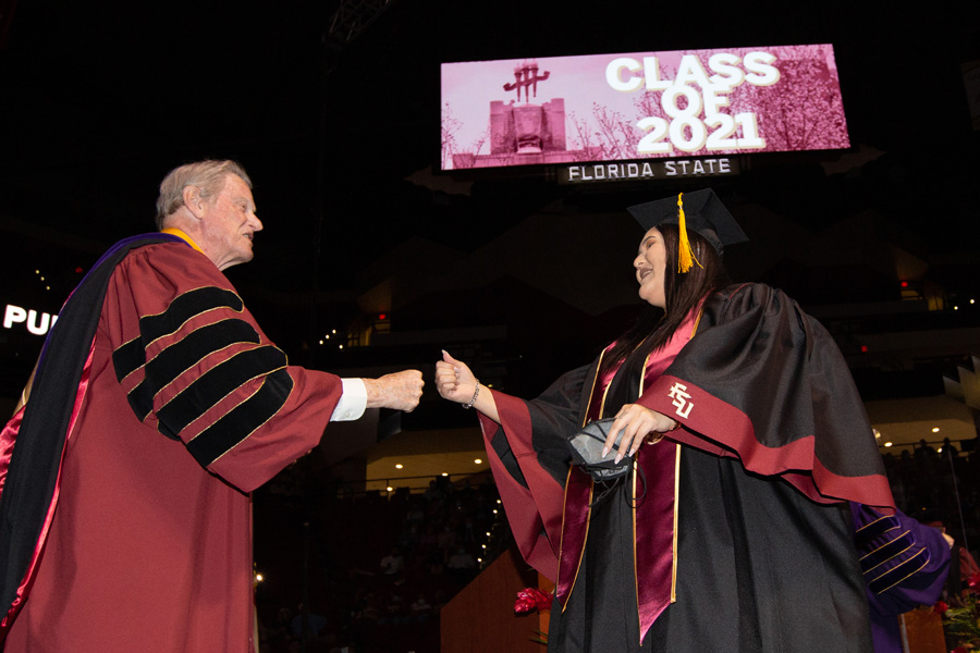 President Thrasher congratulates Kirsten Doney, a member of the Seminole Tribe of Florida, on receiving her bachelor's degree during FSU Spring Commencement Friday, April 23, 2021. (FSU Photography Services)
