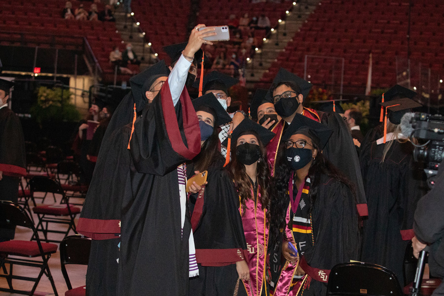 Graduates snap photos during FSU Spring Commencement Friday, April 23, 2021. (FSU Photography Services)